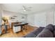 Home office featuring hardwood floors, a comfortable sofa, and plenty of room for storage at 3302 W Beaumont St, Tampa, FL 33611