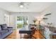 Bright home office featuring hardwood floors, a modern desk, and a window for natural light at 3302 W Beaumont St, Tampa, FL 33611