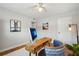 Cozy office space with ceiling fan, hardwood floors, and stylish decor at 3302 W Beaumont St, Tampa, FL 33611