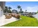 Inviting backyard with new landscaping, lush lawn, dock and waterfront access at 3436 Manatee Se Dr, St Petersburg, FL 33705