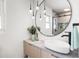 The bathroom features a modern vessel sink, decorative lighting and custom mirror at 3436 Manatee Se Dr, St Petersburg, FL 33705