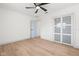 Bright bedroom features an open closet, sleek floors and a modern ceiling fan at 3436 Manatee Se Dr, St Petersburg, FL 33705