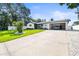 Well-maintained home with lush front yard, updated features, and an attached garage at 3436 Manatee Se Dr, St Petersburg, FL 33705