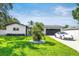 Charming single-story home with well-manicured lawn, modern exterior, and attached garage at 3436 Manatee Se Dr, St Petersburg, FL 33705