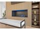 Bright living room featuring a modern fireplace, sleek shelving and bench seating at 3436 Manatee Se Dr, St Petersburg, FL 33705