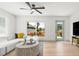 Cozy living room with bright interior, modern furnishings and serene backyard views at 3436 Manatee Se Dr, St Petersburg, FL 33705