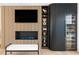 Modern living room boasts a fireplace, TV, custom shelves and a beverage fridge at 3436 Manatee Se Dr, St Petersburg, FL 33705