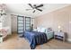 Stylish main bedroom with modern decor, sliding closet doors and plenty of natural light at 3436 Manatee Se Dr, St Petersburg, FL 33705