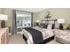Well-decorated bedroom with a comfortable bed, stylish accents, and a window with natural light at 3472 Timber Crossing Ave, Brandon, FL 33511