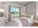 Calm bedroom featuring a large window, neutral color palette and tray-striped ceiling at 3472 Timber Crossing Ave, Brandon, FL 33511