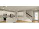 Beautiful kitchen with stainless appliances and access to stairs at 3472 Timber Crossing Ave, Brandon, FL 33511