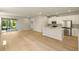 Spacious living area leading to a modern kitchen and an outdoor patio at 3472 Timber Crossing Ave, Brandon, FL 33511