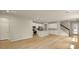 Open floor plan with kitchen, living area, and a staircase at 3472 Timber Crossing Ave, Brandon, FL 33511