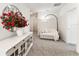 Bright neutral room featuring a plush love seat and elegant buffet table at 35780 Sunflower Hill Dr, Zephyrhills, FL 33541