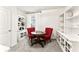 Cozy dining area featuring red chairs, natural light, and stylish decor at 35780 Sunflower Hill Dr, Zephyrhills, FL 33541