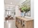 Inviting entryway with tile floors, decorative mirror, that offers a glimpse into the dining area at 35780 Sunflower Hill Dr, Zephyrhills, FL 33541