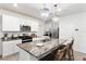 Well-equipped kitchen featuring granite countertops, stainless steel appliances, and a breakfast bar at 35780 Sunflower Hill Dr, Zephyrhills, FL 33541