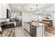 Spacious kitchen with granite countertops, stainless steel appliances, and convenient access to the dining area at 35780 Sunflower Hill Dr, Zephyrhills, FL 33541