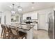 Modern kitchen with granite countertops, stainless steel appliances, and pendant lighting at 35780 Sunflower Hill Dr, Zephyrhills, FL 33541