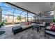 Enjoy outdoor living on this beautiful screened patio with ample seating at 35780 Sunflower Hill Dr, Zephyrhills, FL 33541