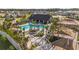 Community pool, splash pad and lounging area with lush tropical landscaping at 35780 Sunflower Hill Dr, Zephyrhills, FL 33541