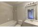Neutral bathroom features a tub and shower combination, toilet, and single sink vanity at 3730 Elmwood Dr, Holiday, FL 34691