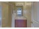 Bathroom features shower with glass door and single sink vanity at 3730 Elmwood Dr, Holiday, FL 34691