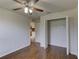 Bedroom with wood flooring, ceiling fan and a closet at 3730 Elmwood Dr, Holiday, FL 34691