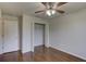 Bedroom with wood floors, closet and ceiling fan at 3730 Elmwood Dr, Holiday, FL 34691