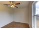 Bedroom featuring wood flooring, a ceiling fan, and natural light at 3730 Elmwood Dr, Holiday, FL 34691