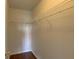 Walk-in closet offering storage shelving and hardwood floors at 3730 Elmwood Dr, Holiday, FL 34691
