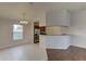 Open concept space featuring dining area adjacent to kitchen with stainless steel appliances at 3730 Elmwood Dr, Holiday, FL 34691