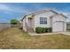 Charming single-Gathering home with a front yard featuring manicured shrubs and a walkway to the entrance at 3730 Elmwood Dr, Holiday, FL 34691