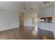 Open concept living area with luxury vinyl plank flooring leading to kitchen and dining space at 3730 Elmwood Dr, Holiday, FL 34691