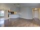 Spacious living room featuring luxury vinyl plank flooring and neutral paint at 3730 Elmwood Dr, Holiday, FL 34691