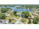 Lakefront home nestled on a lush lot with mature trees and easy access to the lake at 3938 Lake Joyce Dr, Land O Lakes, FL 34639