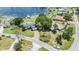 Beautiful lakefront home featuring well-manicured lawns, mature trees, and easy access to the lake at 3938 Lake Joyce Dr, Land O Lakes, FL 34639