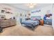 Bedroom with a ceiling fan, natural light, a dresser, and a calming color scheme at 3938 Lake Joyce Dr, Land O Lakes, FL 34639