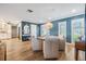 Stylish dining area with hardwood floors and modern decor, seamlessly connected to the kitchen at 3938 Lake Joyce Dr, Land O Lakes, FL 34639