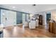 Bright dining room with hardwood floors, stylish furniture, and natural light streaming in through the windows at 3938 Lake Joyce Dr, Land O Lakes, FL 34639