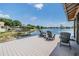 Dockside seating area with chairs offers scenic waterfront views from the private boat dock at 3938 Lake Joyce Dr, Land O Lakes, FL 34639