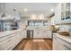 Spacious kitchen features granite countertops, stainless appliances, and picturesque backyard views at 3938 Lake Joyce Dr, Land O Lakes, FL 34639