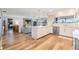 Open-concept kitchen boasts white cabinetry, stainless appliances, and seamless flow to the living area at 3938 Lake Joyce Dr, Land O Lakes, FL 34639