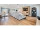 Open-concept living room featuring hardwood floors, modern decor, and plenty of natural light at 3938 Lake Joyce Dr, Land O Lakes, FL 34639