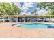 Lovely pool with spa, brick patio, and covered patio are perfect for enjoying outdoor living at 3938 Lake Joyce Dr, Land O Lakes, FL 34639