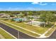 Aerial view showcases the community pool, the bocce ball court, and neatly landscaped common areas at 4017 103Rd N Ave, Clearwater, FL 33762