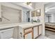 Bathroom featuring a shower/tub combo, grab bars, and single sink with medicine cabinet at 4017 103Rd N Ave, Clearwater, FL 33762