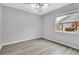 Bedroom featuring hard surface flooring and a window with outside view at 4017 103Rd N Ave, Clearwater, FL 33762