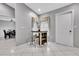 A bright breakfast nook features a small table and an adjacent door to the outside at 4017 103Rd N Ave, Clearwater, FL 33762