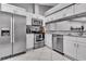 Bright kitchen features stainless appliances and granite countertops at 4017 103Rd N Ave, Clearwater, FL 33762